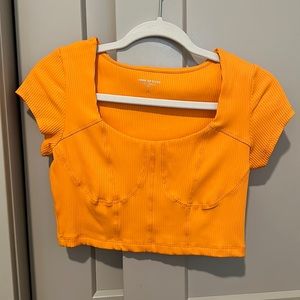 Bright orange cropped top
